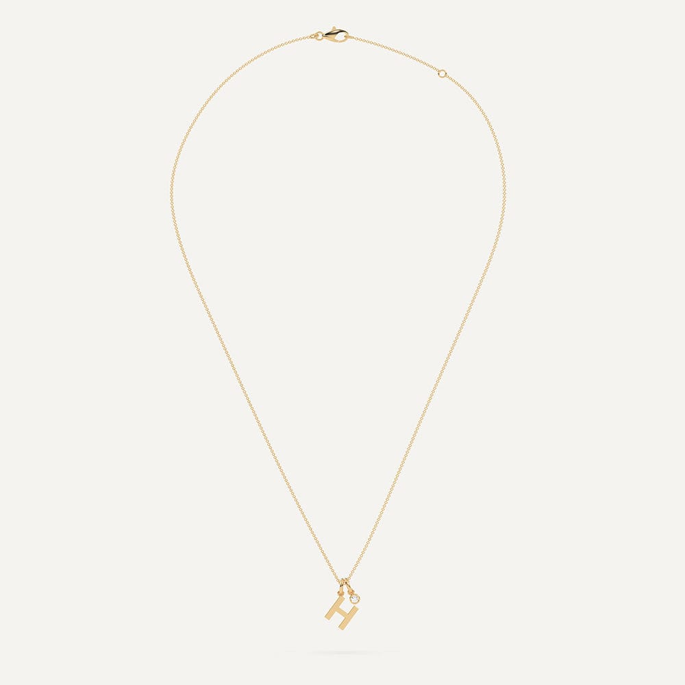 Gold necklace with letter H