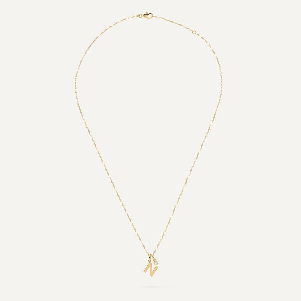 Gold necklace with letter N