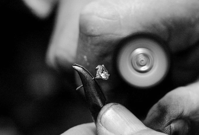 Jeweler Cleaning Real Diamond Earring