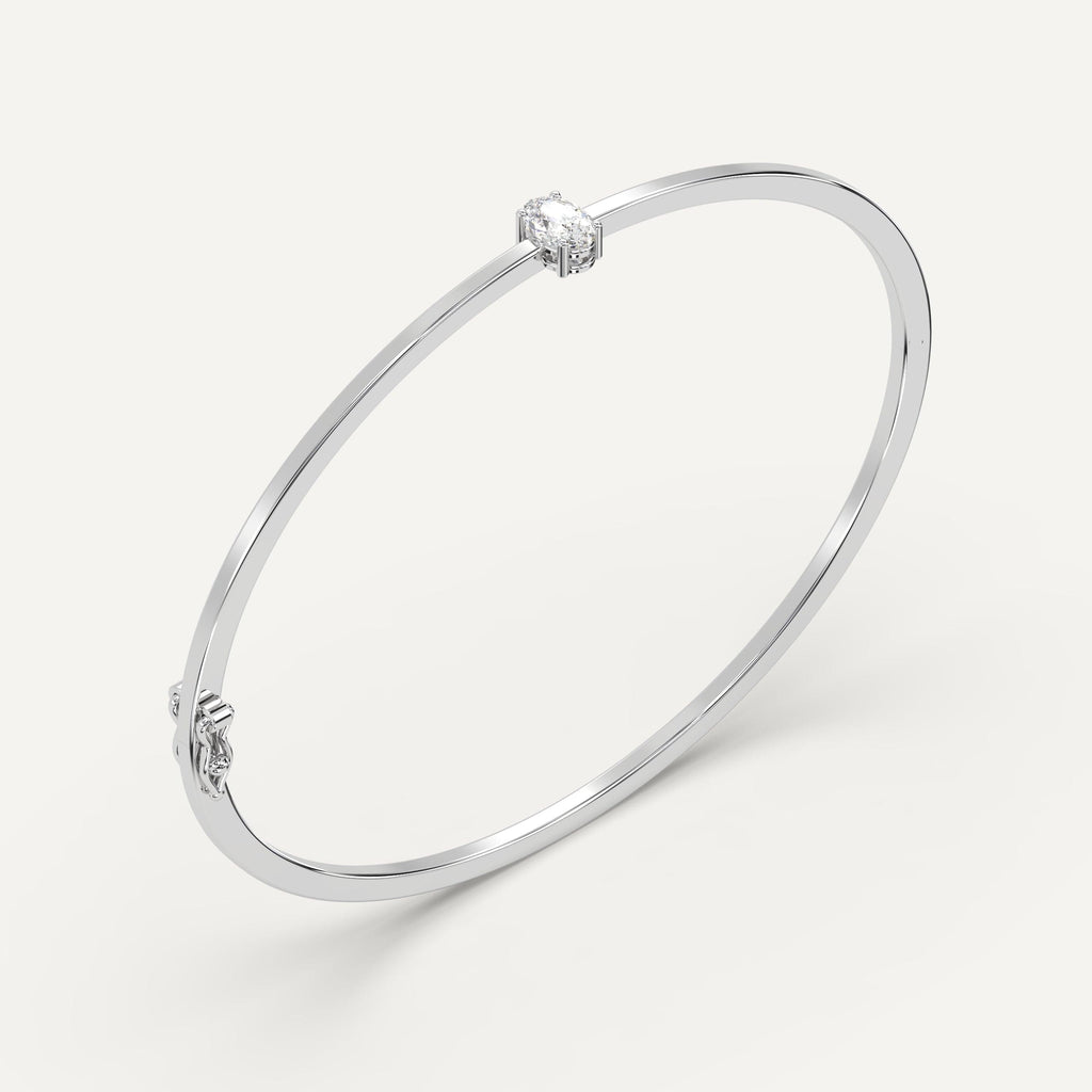 white gold solitaire, bangle bracelets with 1/2 carat oval diamonds