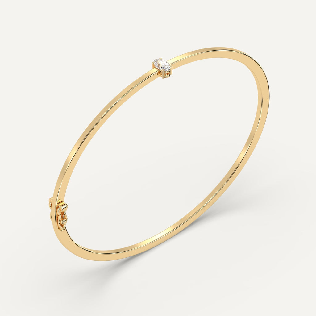 yellow gold solitaire, bangle bracelets with 1/4 carat oval diamonds
