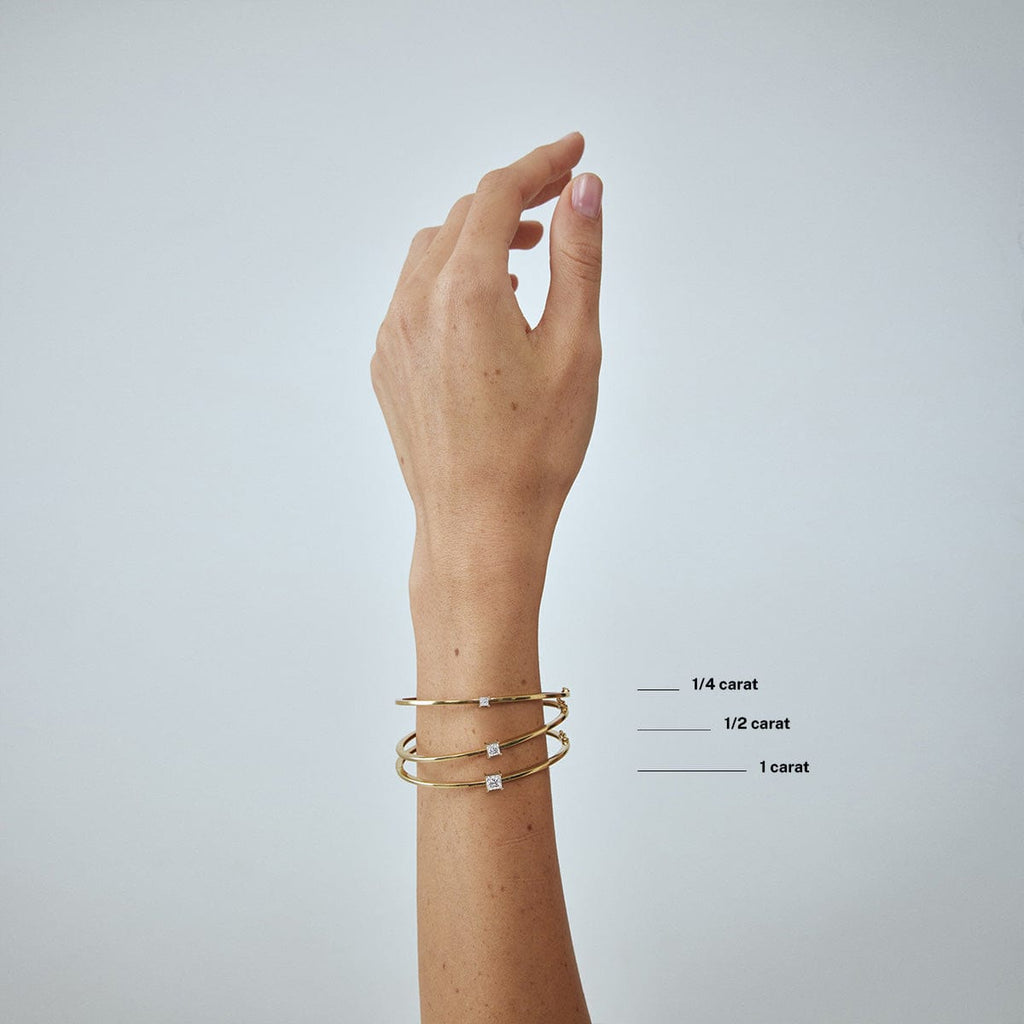 compare princess diamond carat weight bracelets on model's wrist arm