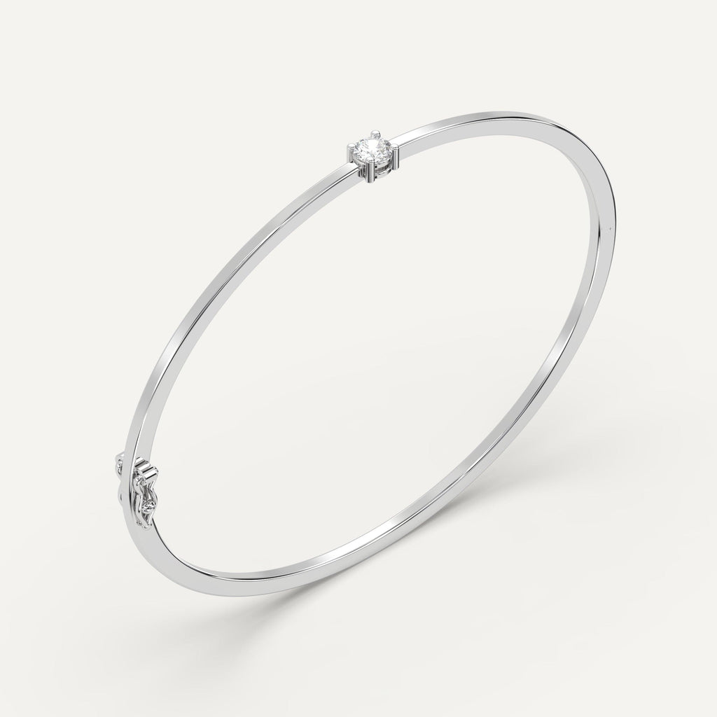 white gold solitaire bangle bracelets with 1/4 carat round diamonds