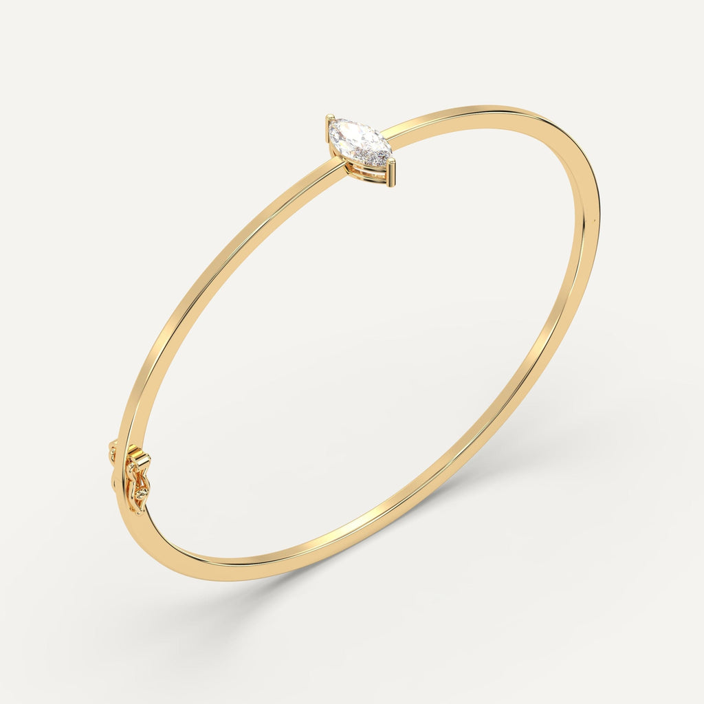 yellow gold solitaire, bangle bracelets with 1 carat marquise diamonds