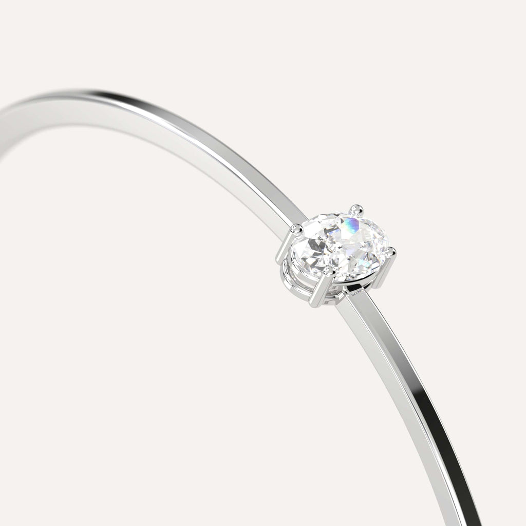 classic diamond solitaire, bangle bracelet with oval natural diamonds in white gold