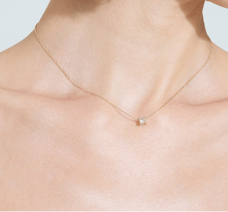 single diamond necklace with 1 carat princess cut on neck