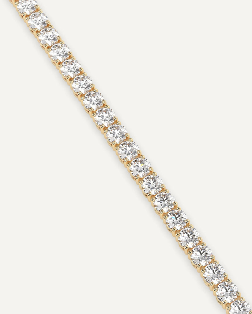 classic diamond tennis bracelet with round natural diamonds in yellow gold