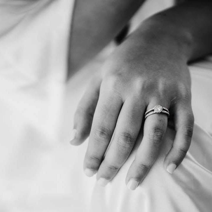Round shape halo engagement ring on bride