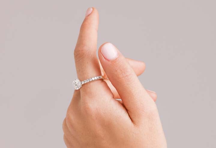 White gold engagement ring on hand