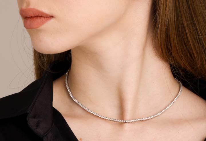 Diamond tennis necklace in white gold on model