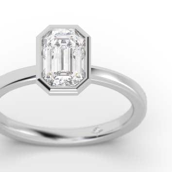 Bezel set natural emerald cut diamond engagement ring