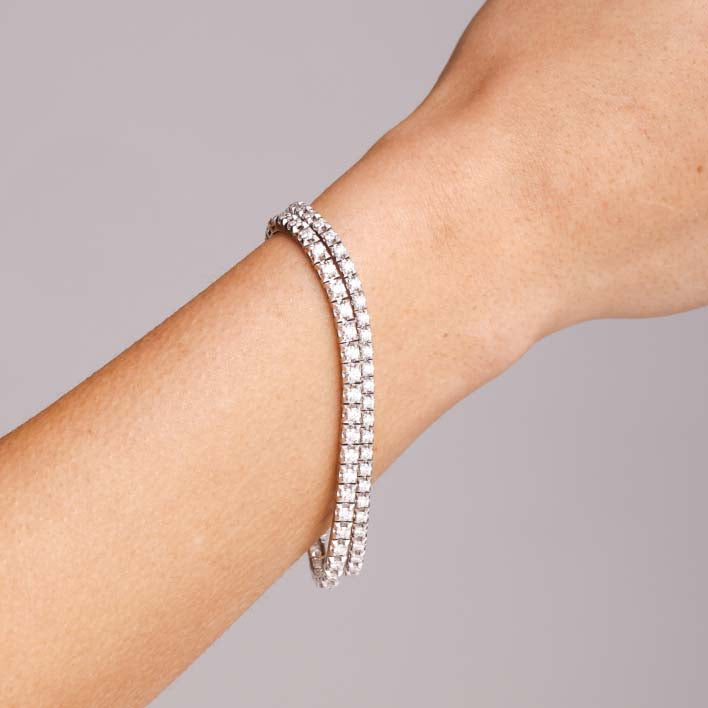 Diamond tennis bracelets on arm