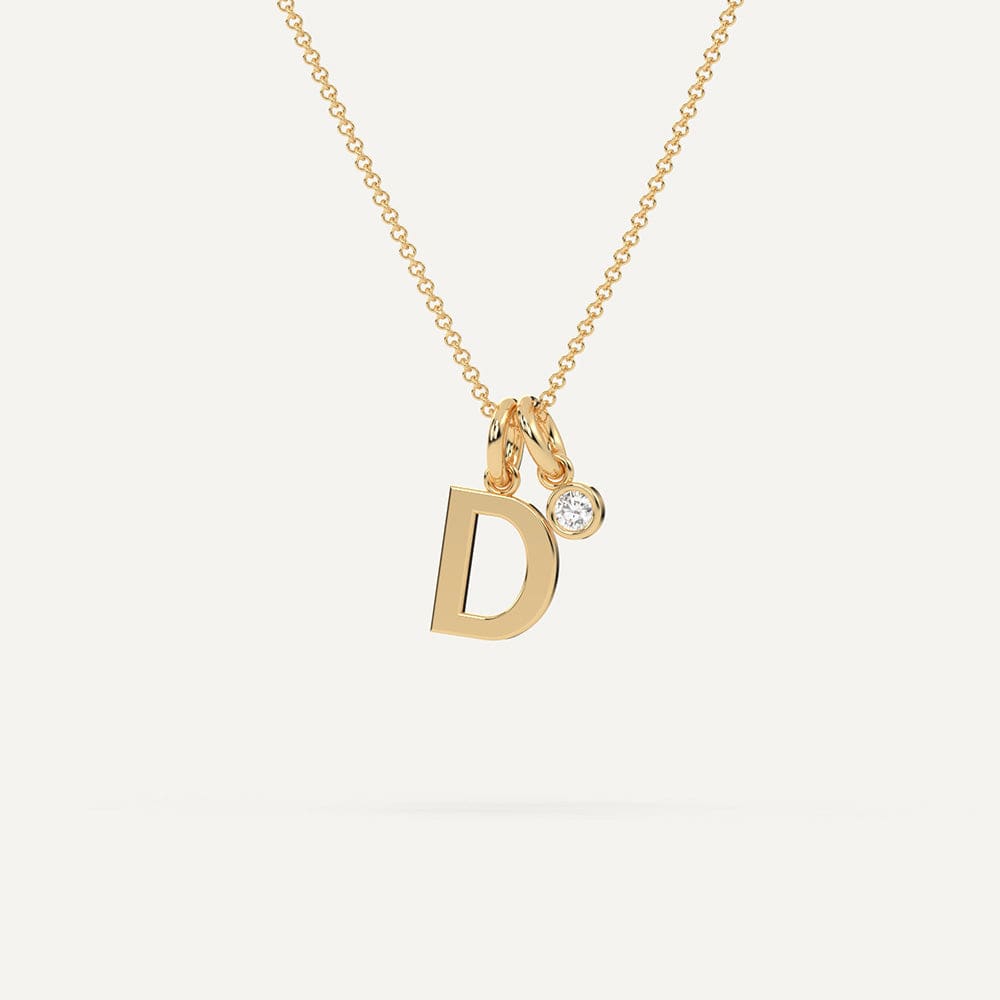 Gold initial D necklace with diamonds