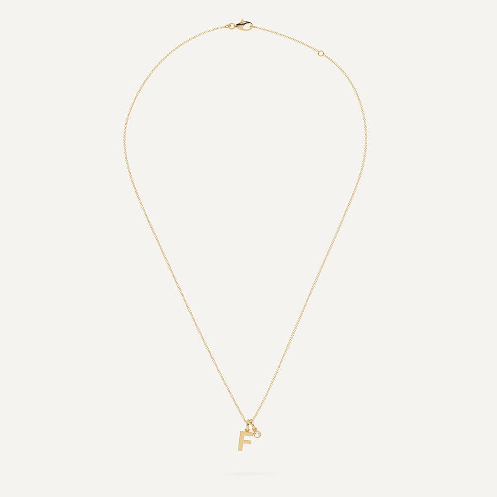 Gold necklace with letter F