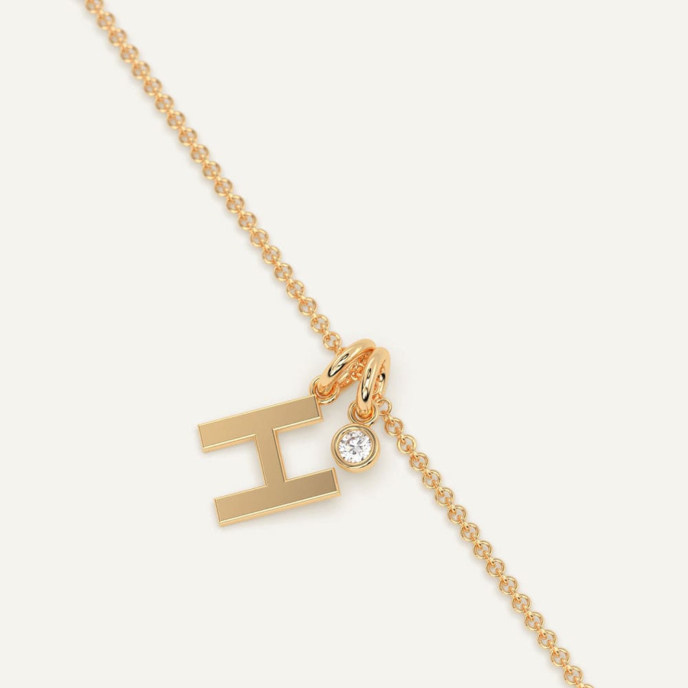 Diamond H white gold necklace