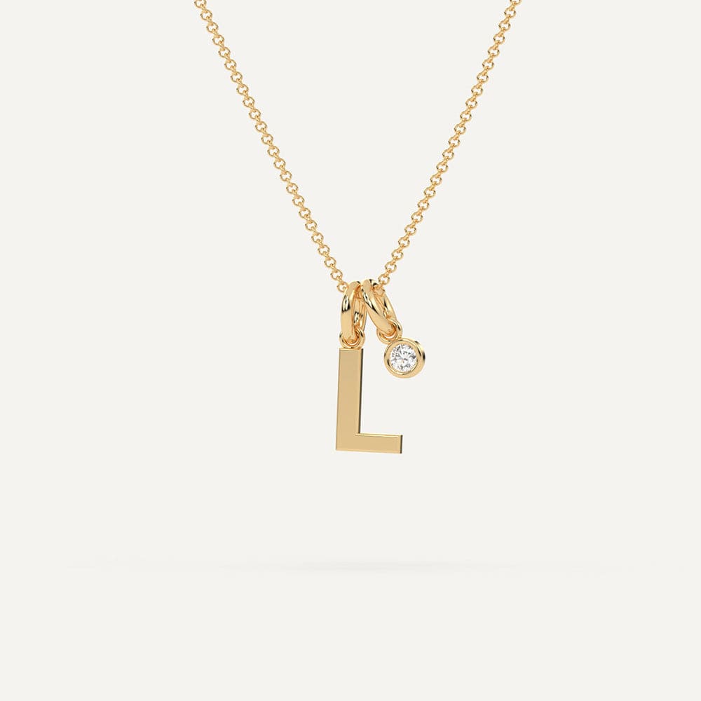 Yellow gold L letter pendant