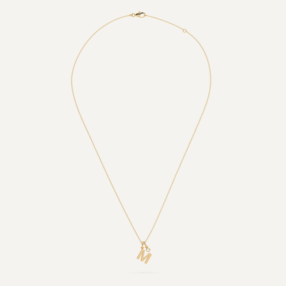 Gold necklace with letter M