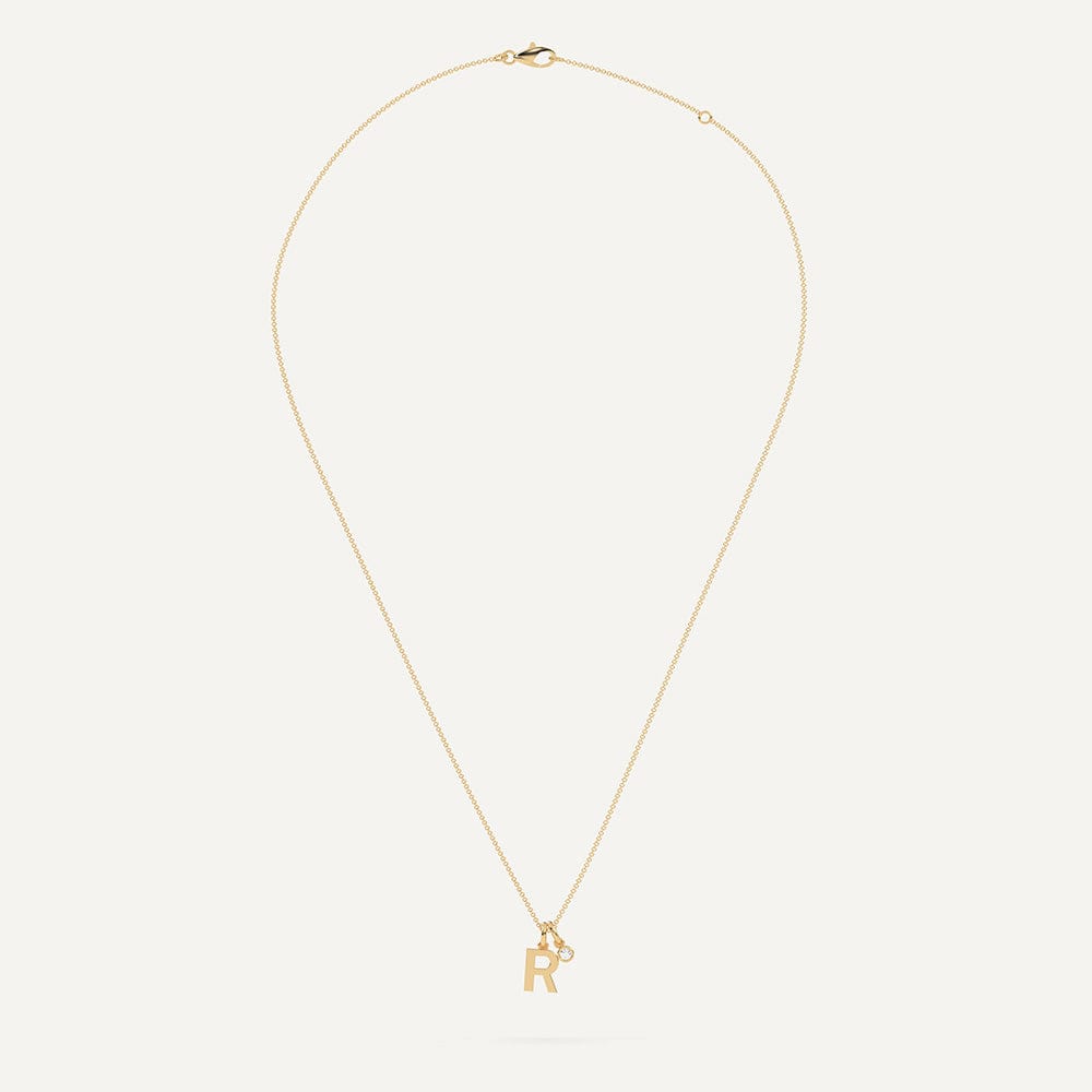 Gold necklace with letter R