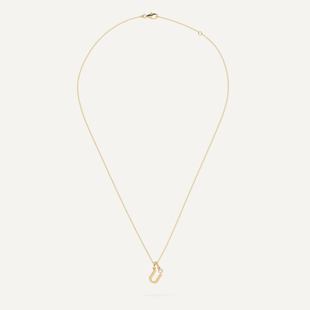 Gold necklace with letter U