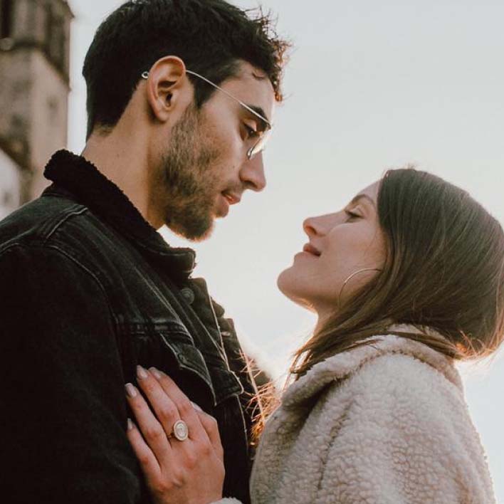 Couple embracing after wedding proposal