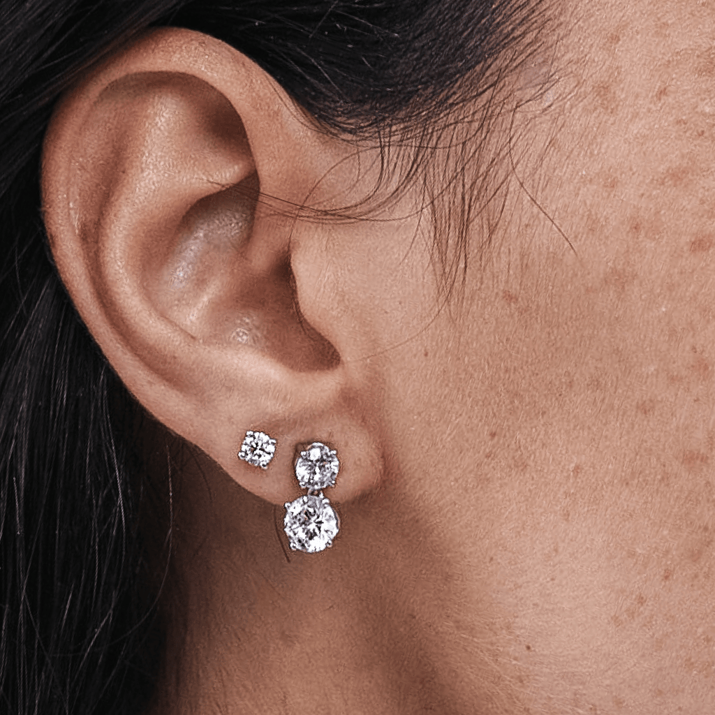 Double Solitaire Diamond Drop Earrings Close-Up on Ear Model